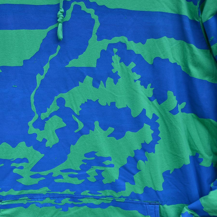 close up print emerald blue wave surfers