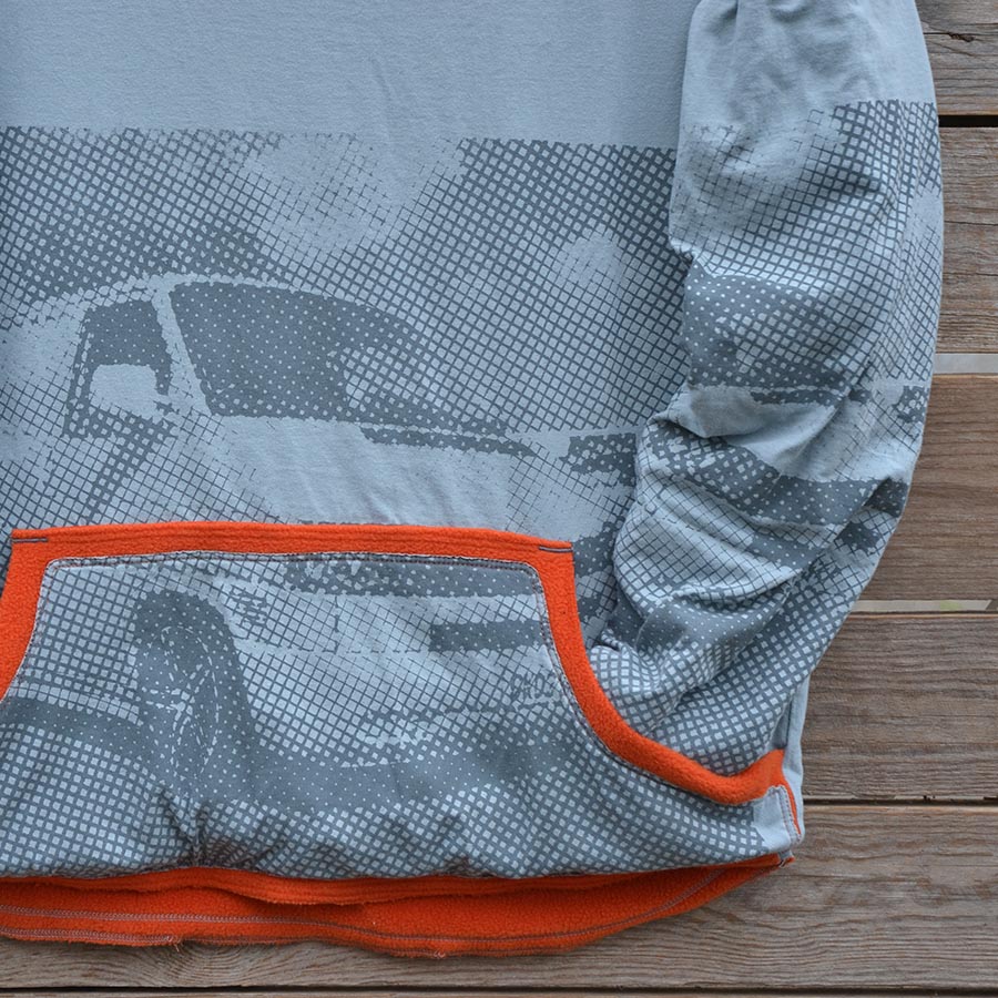 Close up Men's large reversible hoody in orange/grey