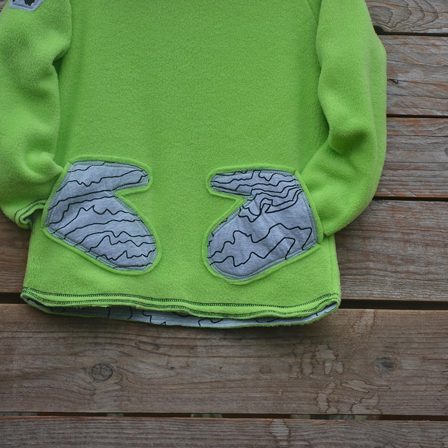 Fleece close up Kid's reversible hoody in lime/marl grey