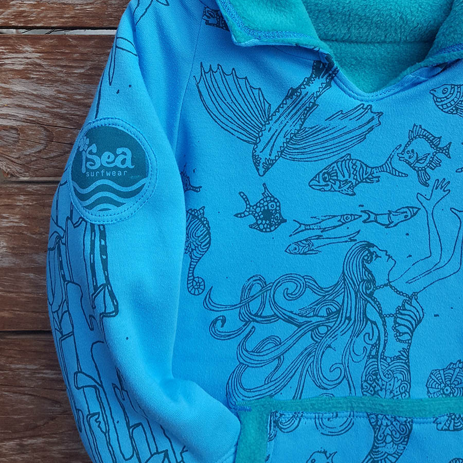 Kid's reversible hoody in jade/turquoise - Close up Kid's reversible hoody in jade/turquoise - close up
