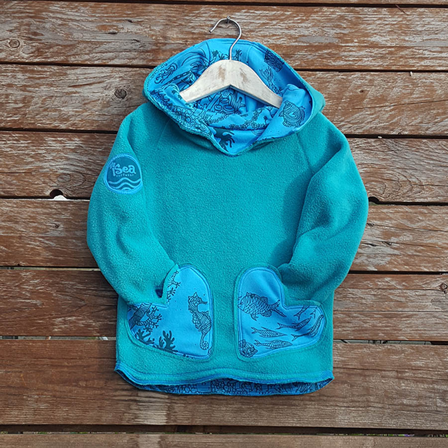 Kid's reversible hoody in jade/turquoise - Fleece Kid's reversible hoody in jade/turquoise - fleece close up