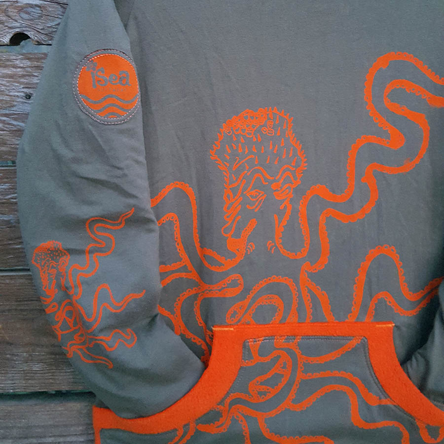 Kid's reversible hoody in orange/olive - Close up Kid's reversible hoody in orange/olive - close up