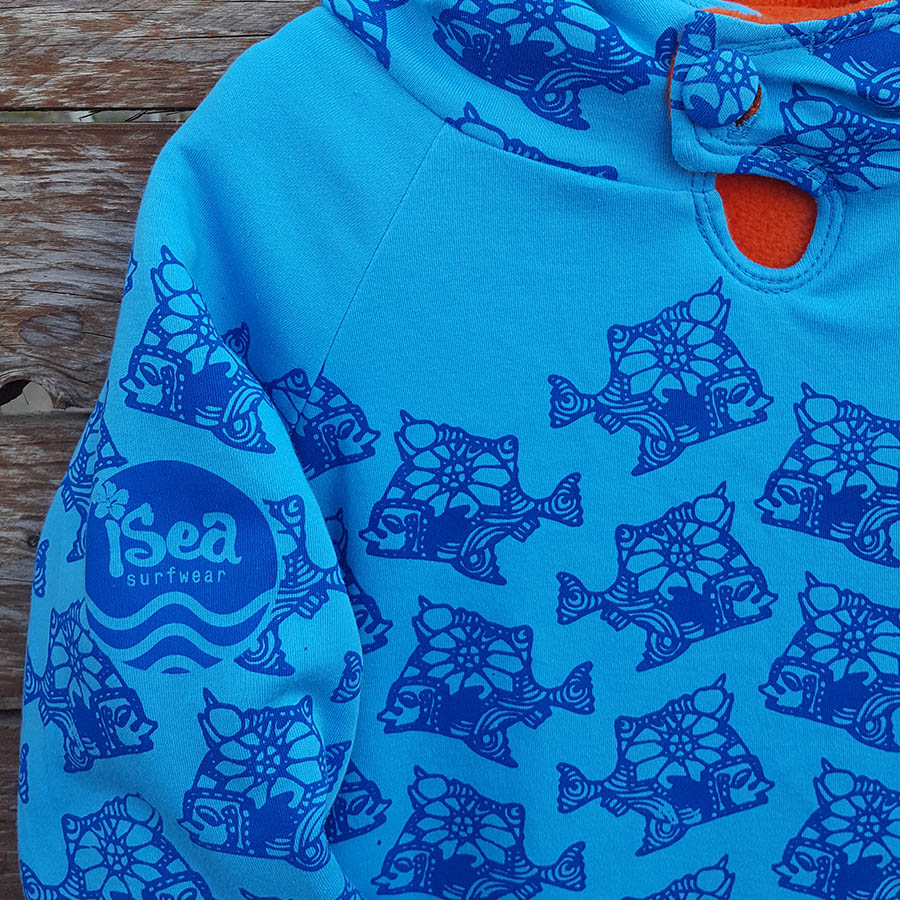 Kid's reversible hoody in orange/turquoise - Close up Kid's reversible hoody in orange/turquoise - close up